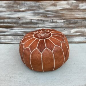 brown leather pouf